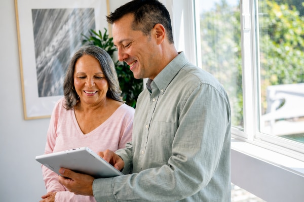  Doctor and patient reviewing tablet together