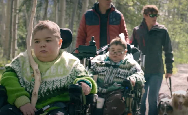 Children with NMD in a wheelchair in nature