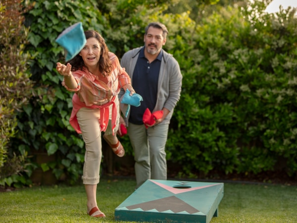  Couple playing cornhole