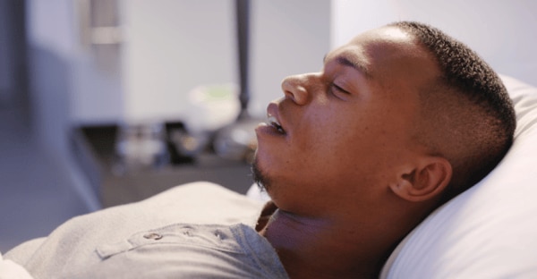  man snoring at night