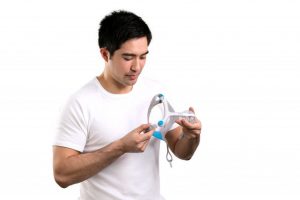 Man with AirFit N20 choosing his right mask size ResMed UK
