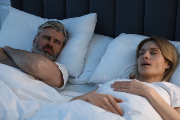  woman snoring in bed
